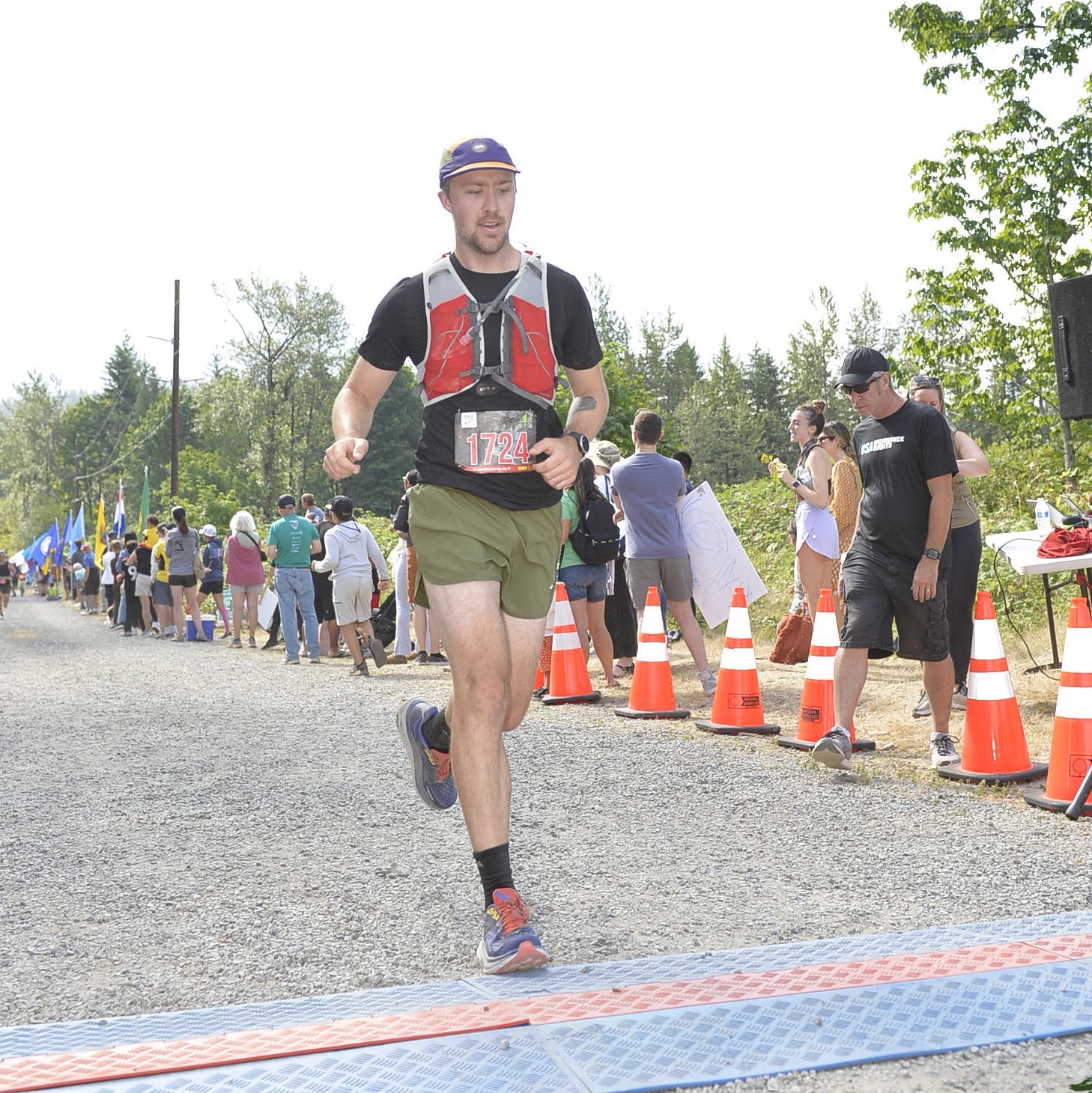 Photo of Matt running across a finish line